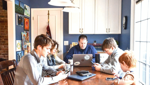 Family members interacting with technology