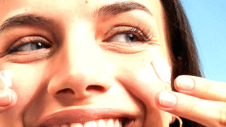 Person applying sunscreen